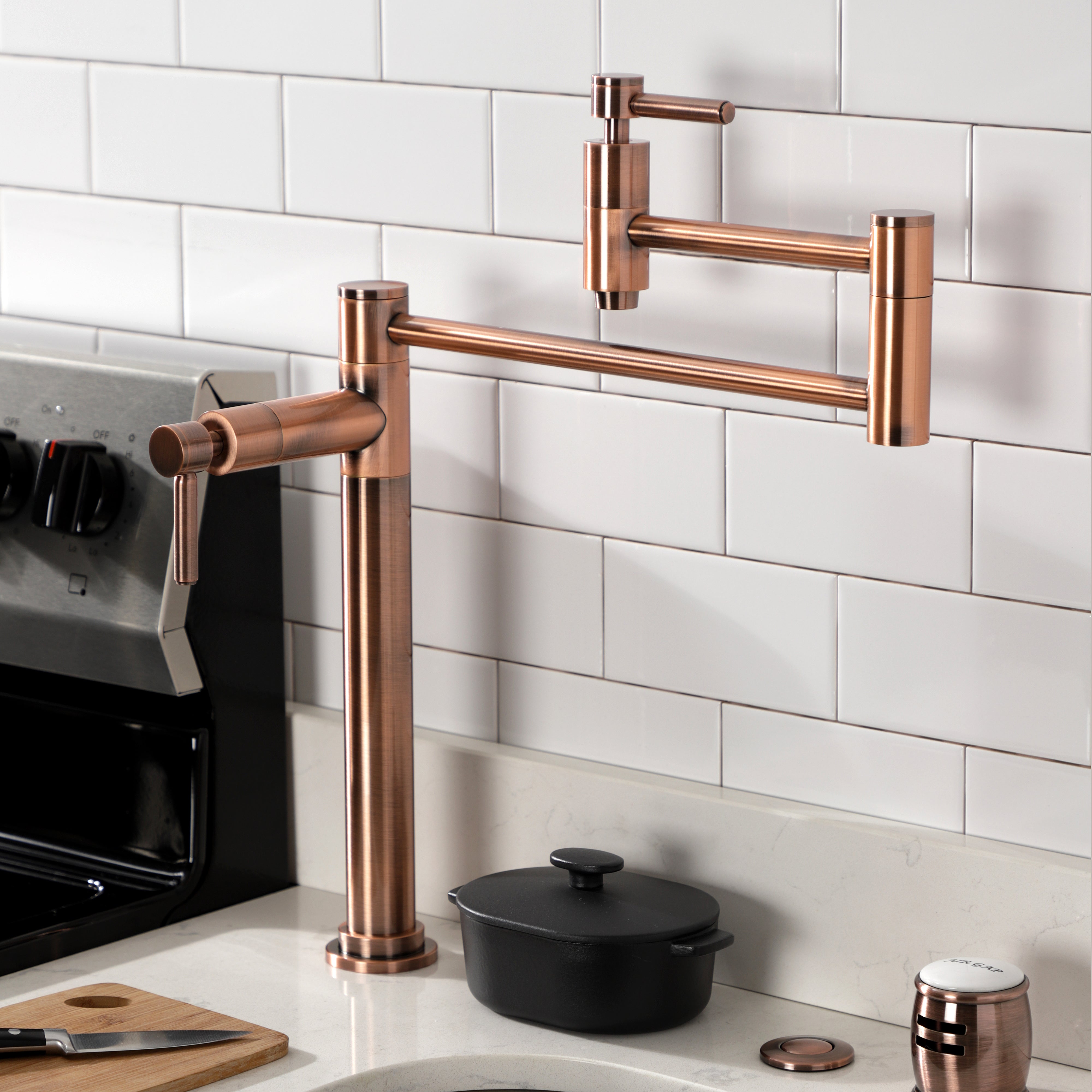 Kingston Brass KS870DLAC Concord Deck Mount Pot Filler Faucet, Antique Copper installed in kitchen.