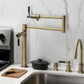 Kingston Brass KS4703DKL Kaiser Deck Mount Pot Filler Faucet, Antique Brass installed in a modern kitchen setting.