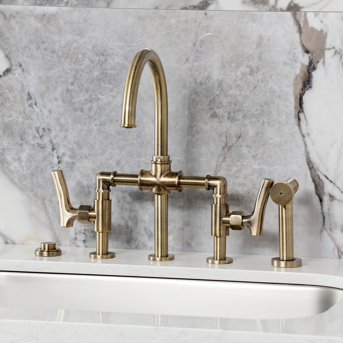 Kingston KS2333TKL Hallerbos Bridge Kitchen Faucet with Brass Sprayer, Antique Brass on marble countertop