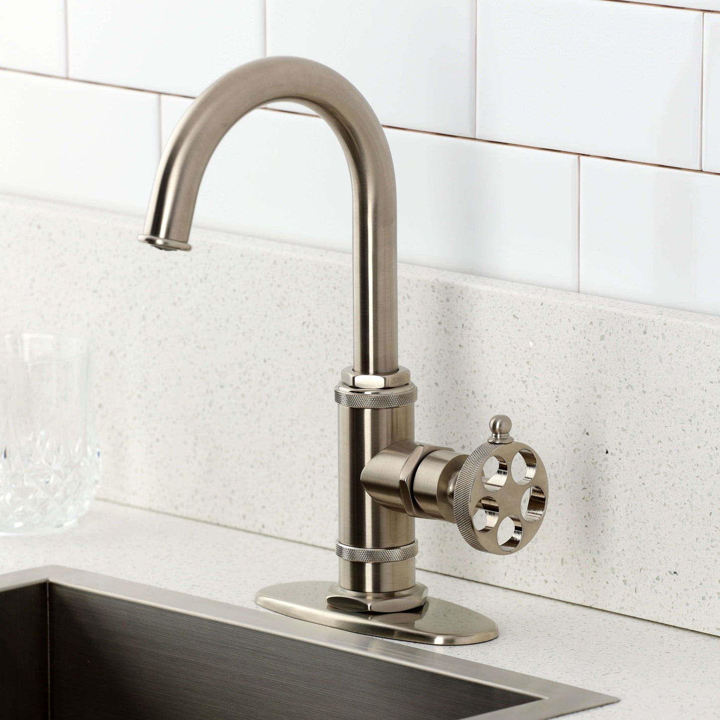 Kingston Brass KSD8503RKZ Wendell Single-Handle Bar Faucet with Knurled Handle, Antique Brass on a kitchen counter