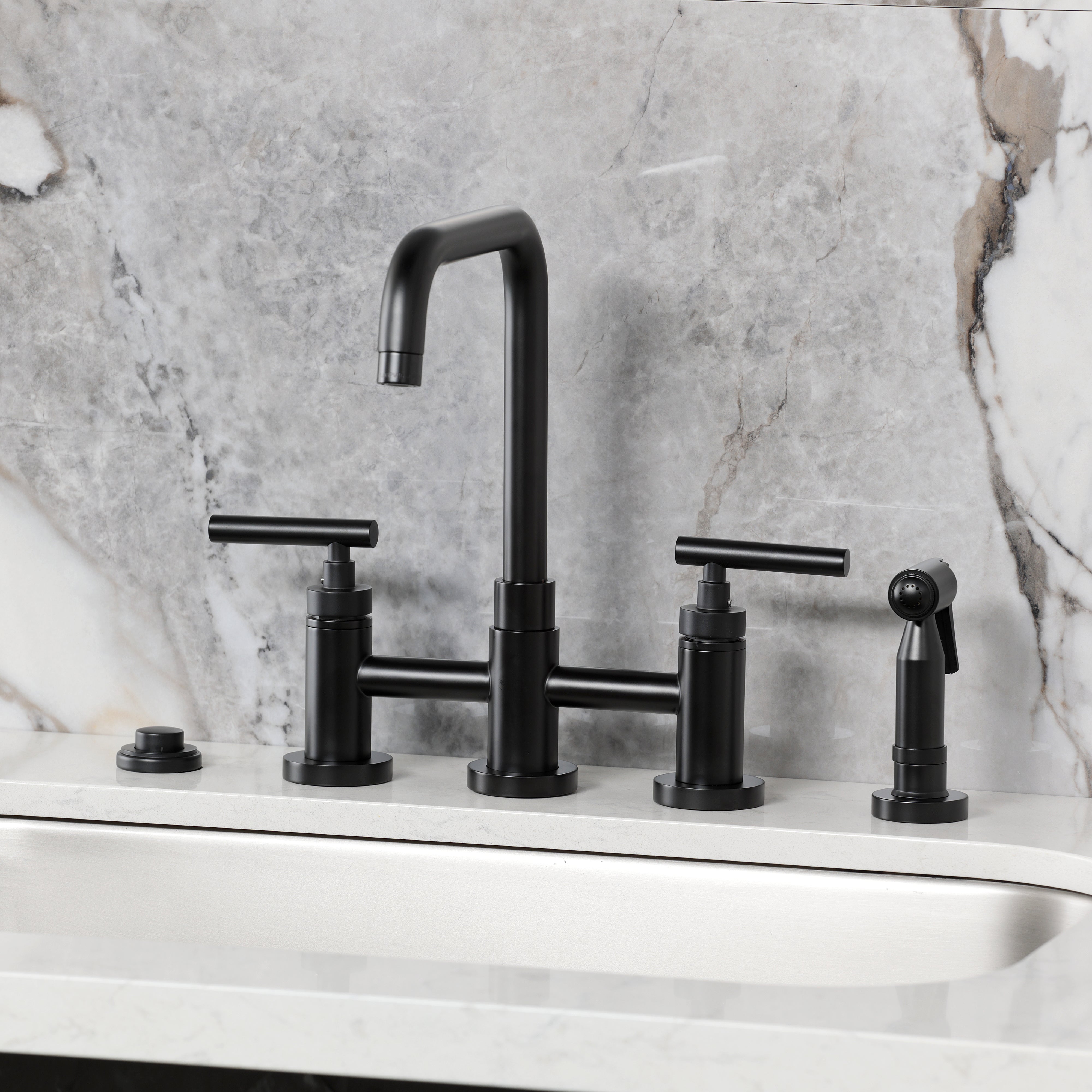 Kingston KS8287CMLBS Manhattan Bridge Kitchen Faucet with Brass Sprayer, Brushed Brass on a modern countertop.