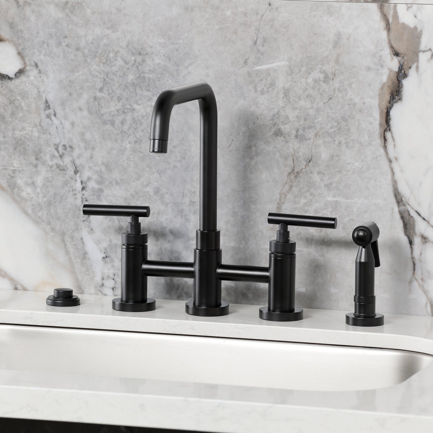 Kingston KS8287CMLBS Manhattan Bridge Kitchen Faucet with Brass Sprayer, Brushed Brass on a modern countertop.