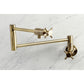 Kingston Brass KS4103DX Concord Wall Mount Pot Filler Faucet, Antique Brass on marble background.
