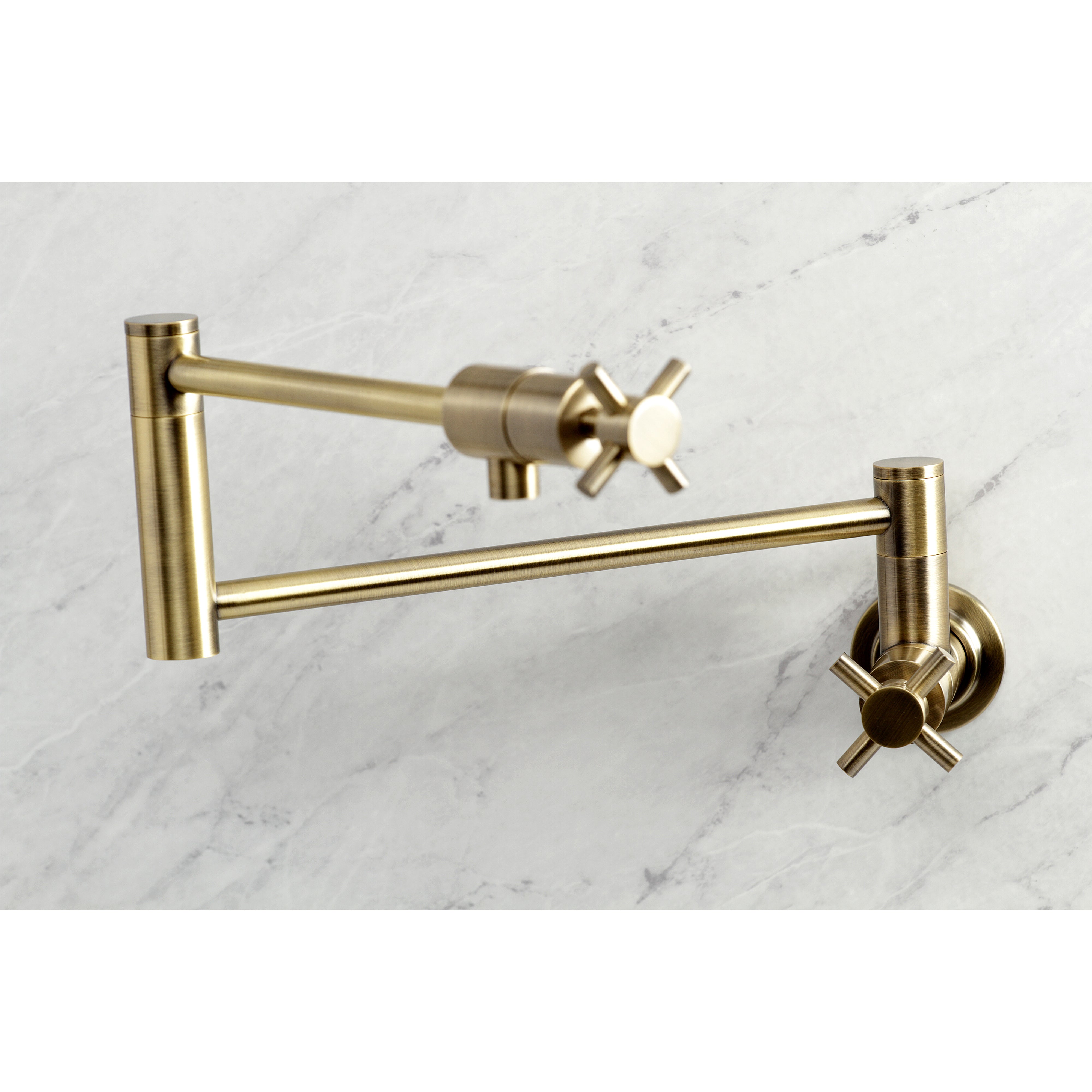 Kingston Brass KS4103DX Concord Wall Mount Pot Filler Faucet, Antique Brass on marble background.