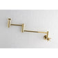 Kingston Brass KS8103ZX Millennium Wall Mount Pot Filler Faucet, Antique Brass on white tile background.