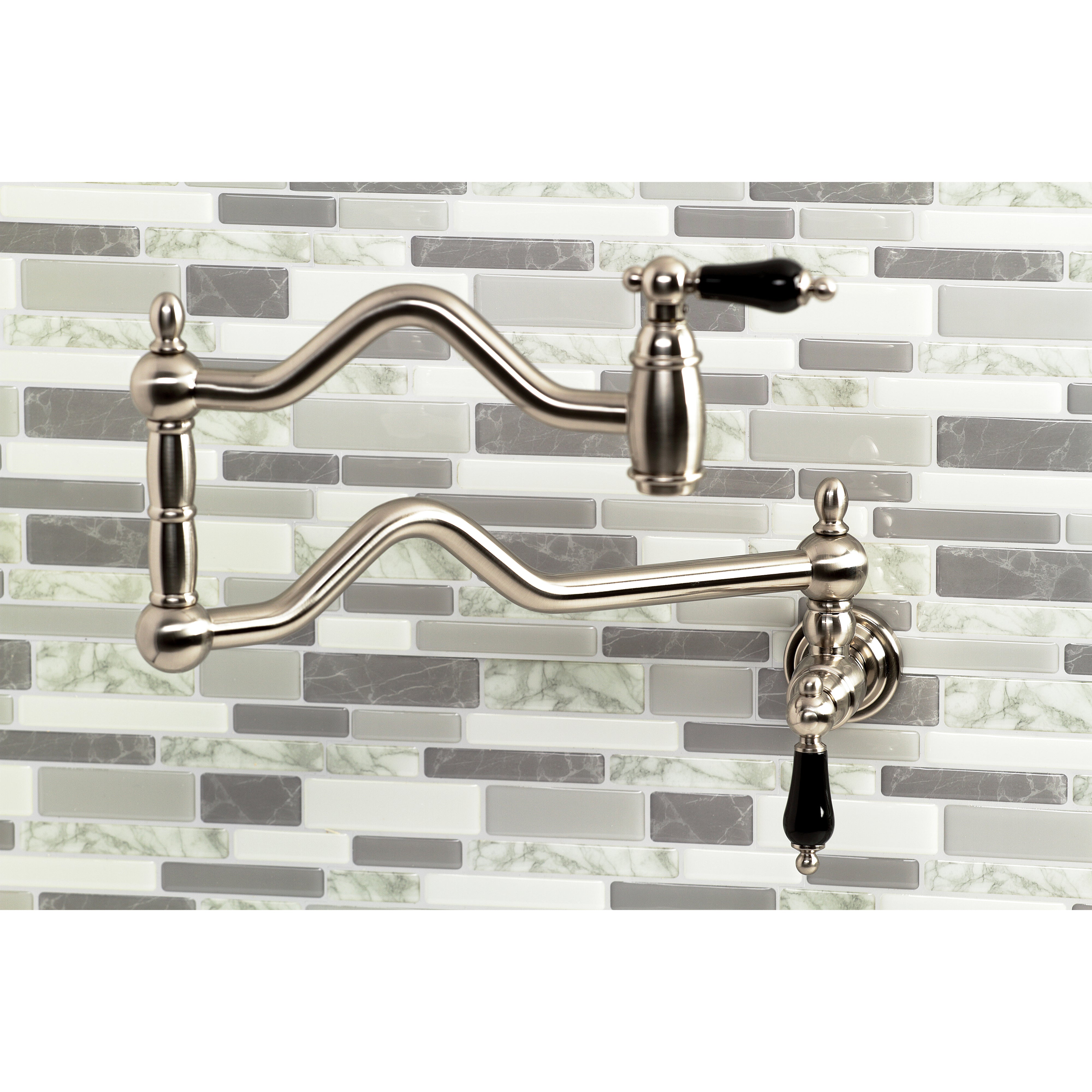Kingston Brass KS2107PKL Duchess Wall Mount Pot Filler Faucet, Brushed Brass with black porcelain handles.