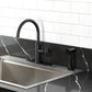 Kingston Brass KSD2433RNX Ostro Single-Handle Kitchen Faucet, Antique Brass in a modern kitchen setting.