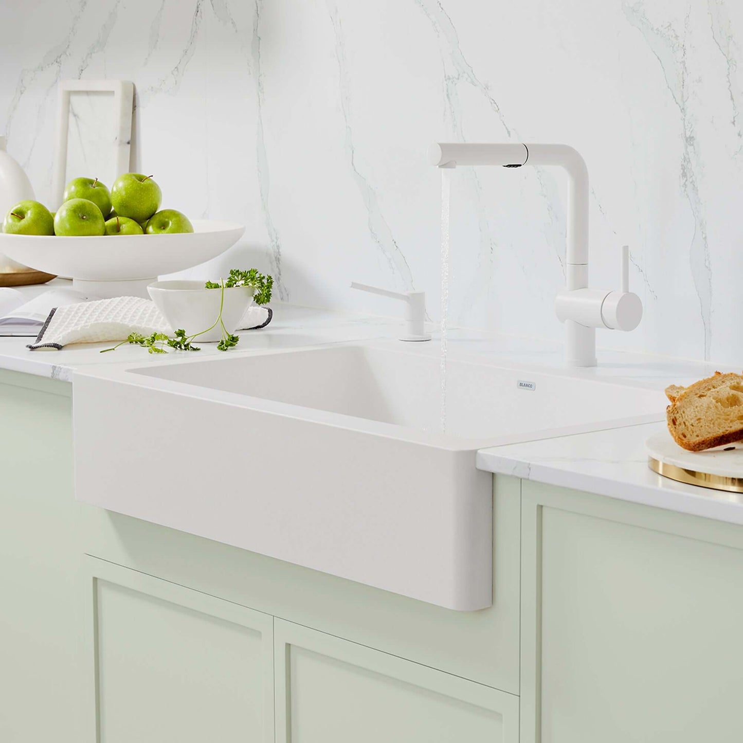 BLANCO VINTERA 30" SILGRANIT Single Bowl Farmhouse Sink with modern faucet and green apples in kitchen setting.