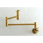 Kingston Brass KS8103ZX Millennium Wall Mount Pot Filler Faucet, Antique Brass on a white tiled wall.