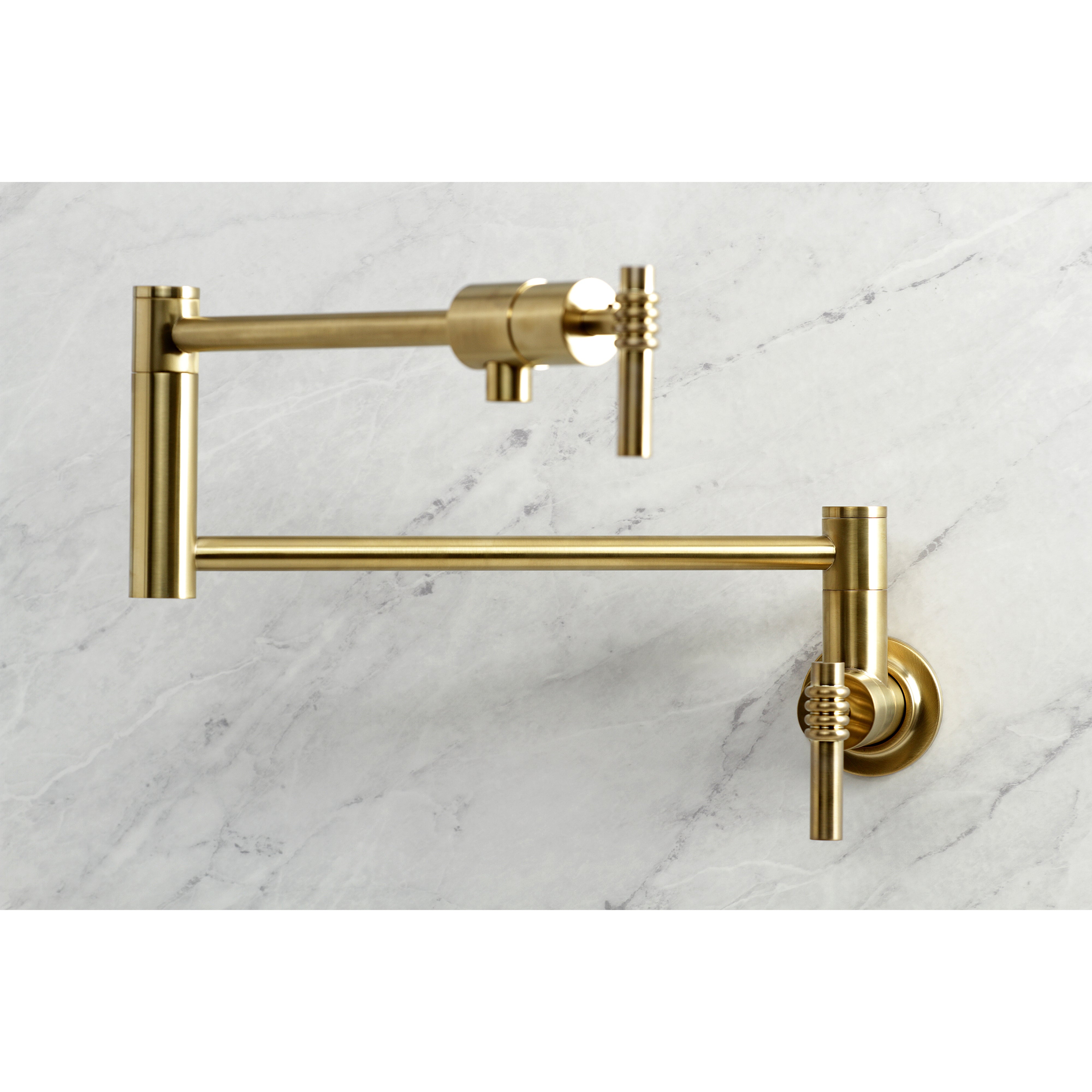 Kingston Brass KS4103ML Milano Wall Mount Pot Filler Faucet, Antique Brass on a marble background.