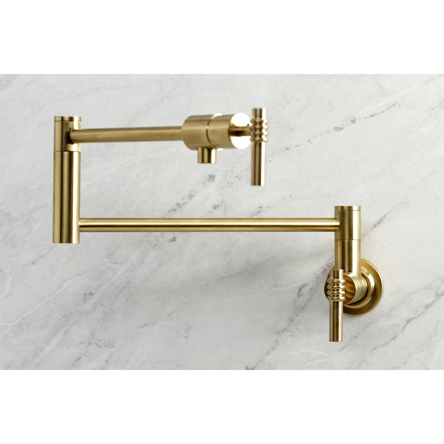 Kingston Brass KS4103ML Milano Wall Mount Pot Filler Faucet, Antique Brass on a marble background.