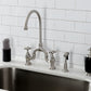Kingston KS7793AXBS English Country Bridge Kitchen Faucet with Brass Sprayer, Antique Brass in a modern kitchen setting.