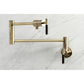 Kingston Brass KS4103CKL Kaiser Wall Mount Pot Filler Faucet, Antique Brass on marble background.