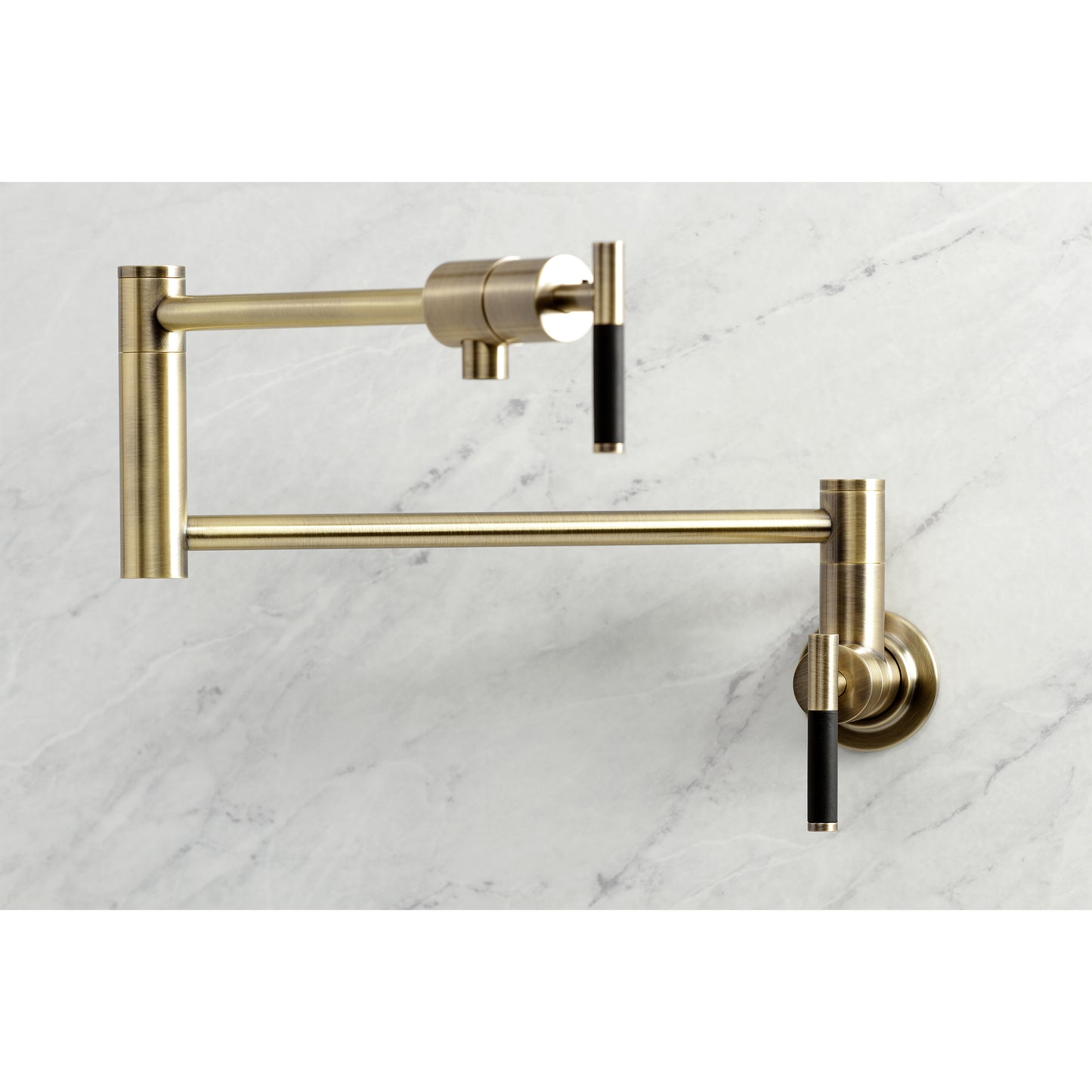 Kingston Brass KS4103CKL Kaiser Wall Mount Pot Filler Faucet, Antique Brass on marble background.