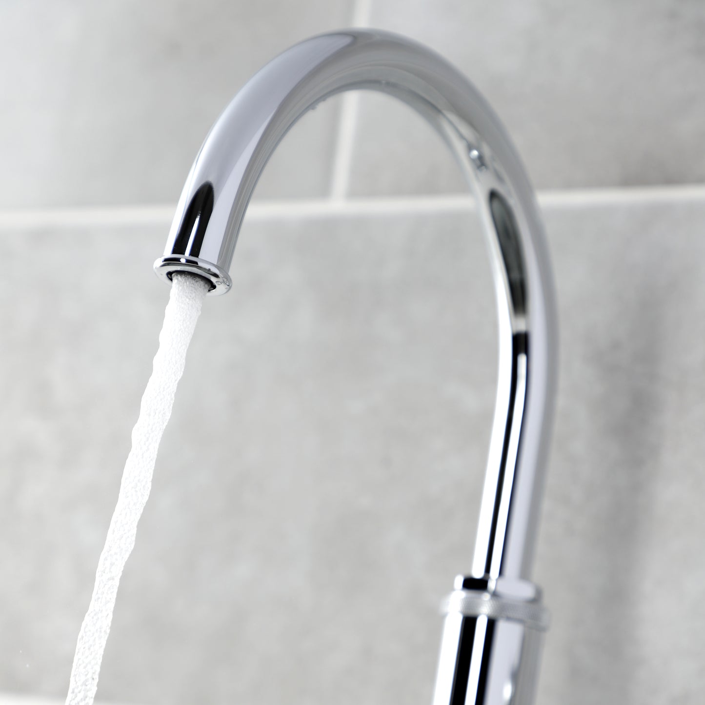 Kingston Brass KS2433KL Whitaker Single-Handle Kitchen Faucet with Brass Side Sprayer, Antique Brass - faucet spout in action.