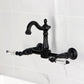 Kingston KS2443WLL Willshire Two-Handle Wall Mount Bridge Kitchen Faucet, Antique Brass in black finish.