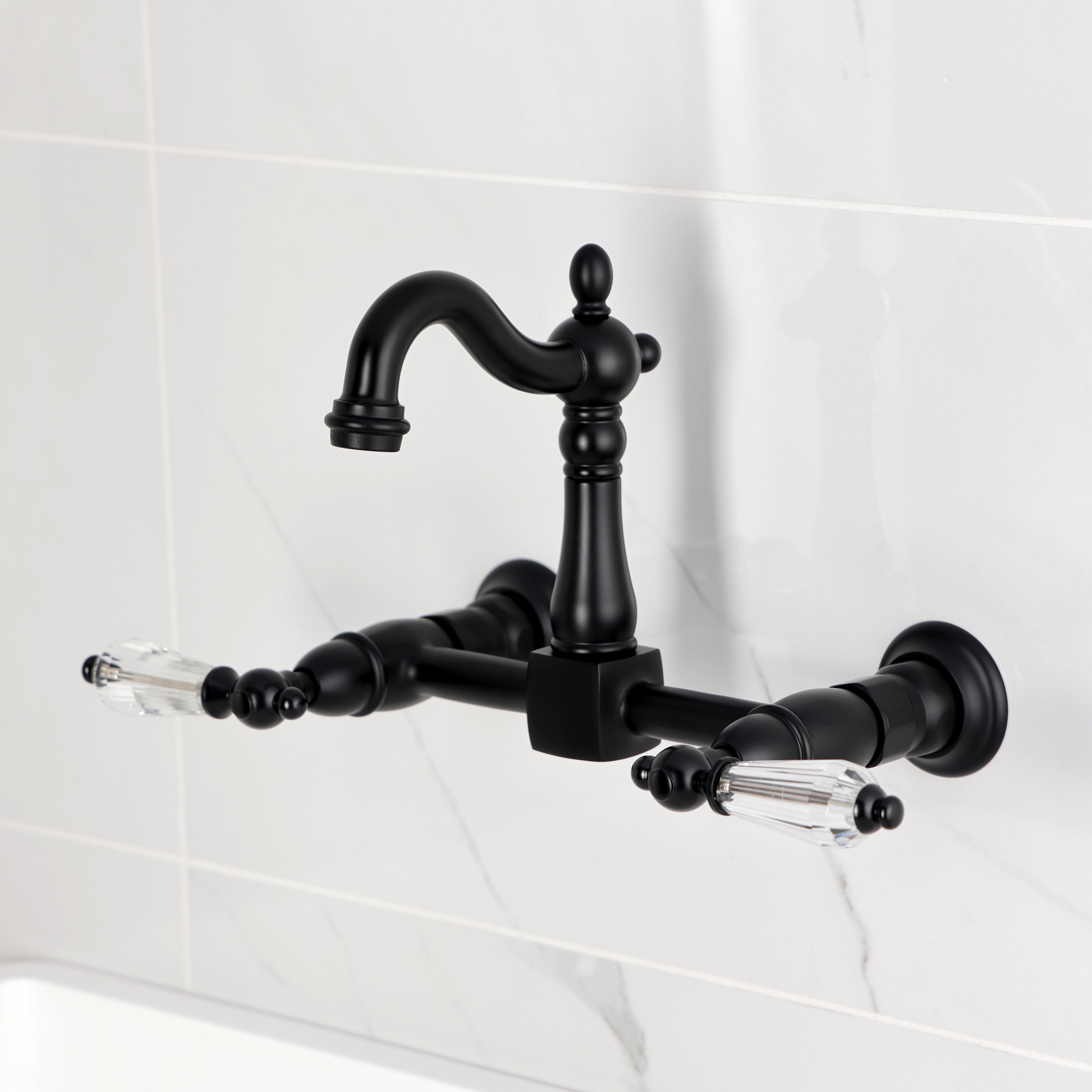 Kingston KS2443WLL Willshire Two-Handle Wall Mount Bridge Kitchen Faucet, Antique Brass in black finish.