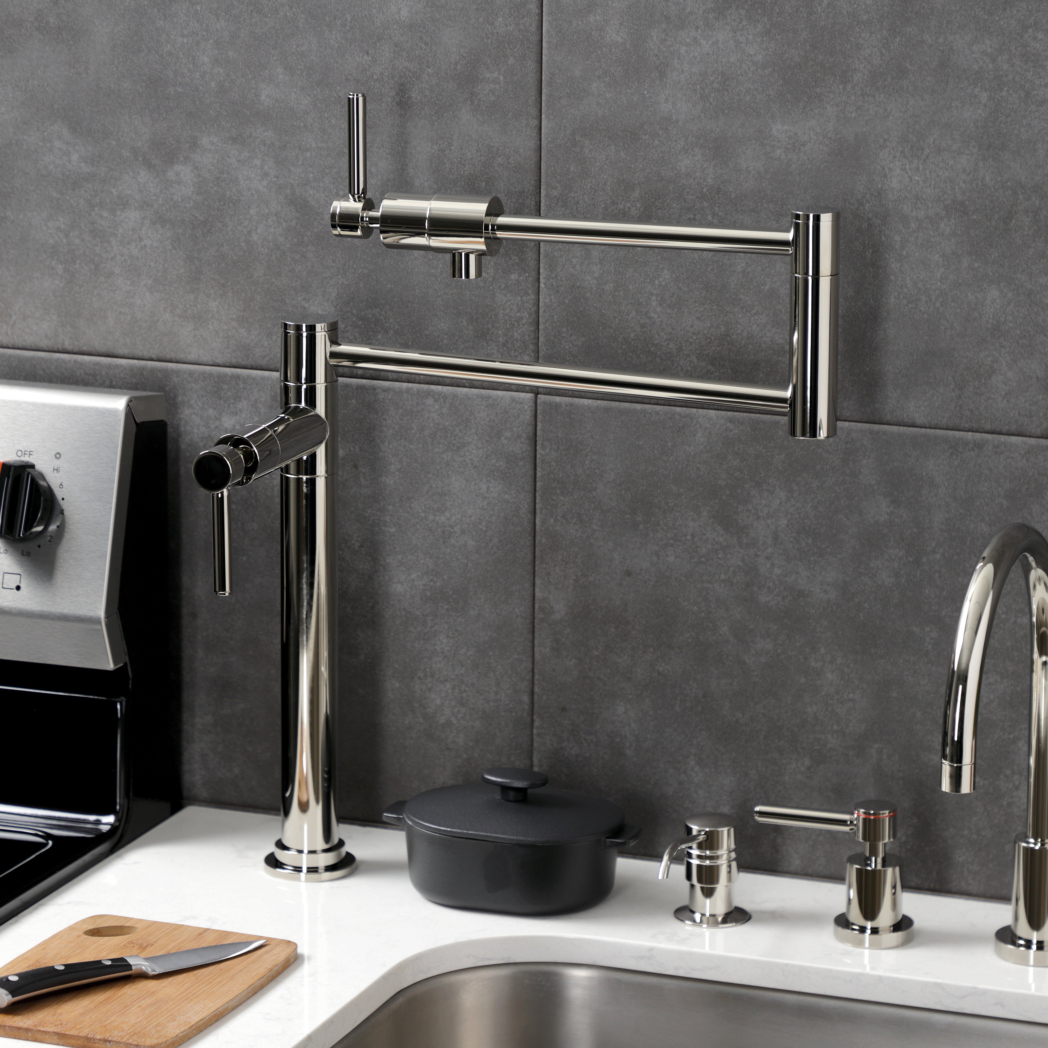 Kingston Brass KS4703DL Concord Deck Mount Pot Filler Faucet, Antique Brass on a kitchen countertop.