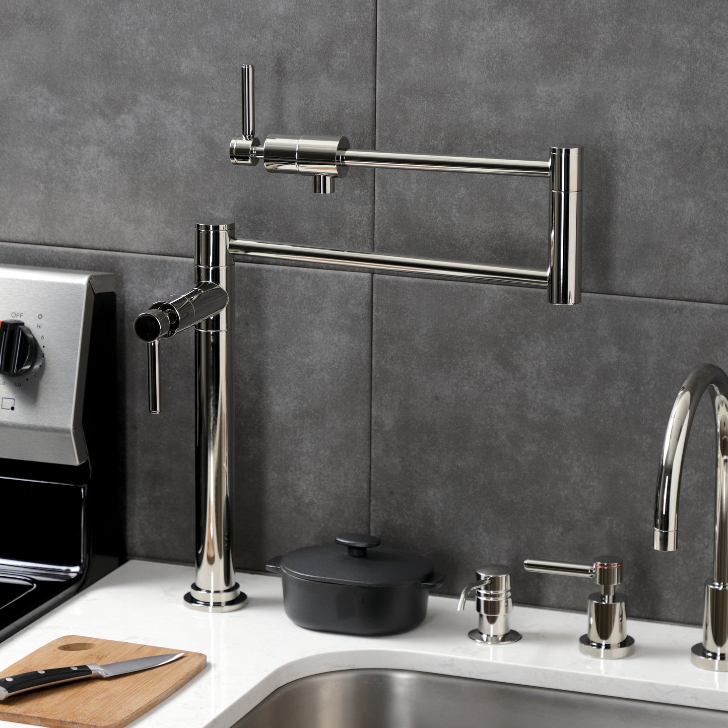 Kingston Brass KS4703DL Concord Deck Mount Pot Filler Faucet, Antique Brass on a kitchen countertop.