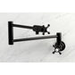 Kingston Brass KS4103BX Metropolitan Wall Mount Pot Filler Faucet, Antique Brass on marble background
