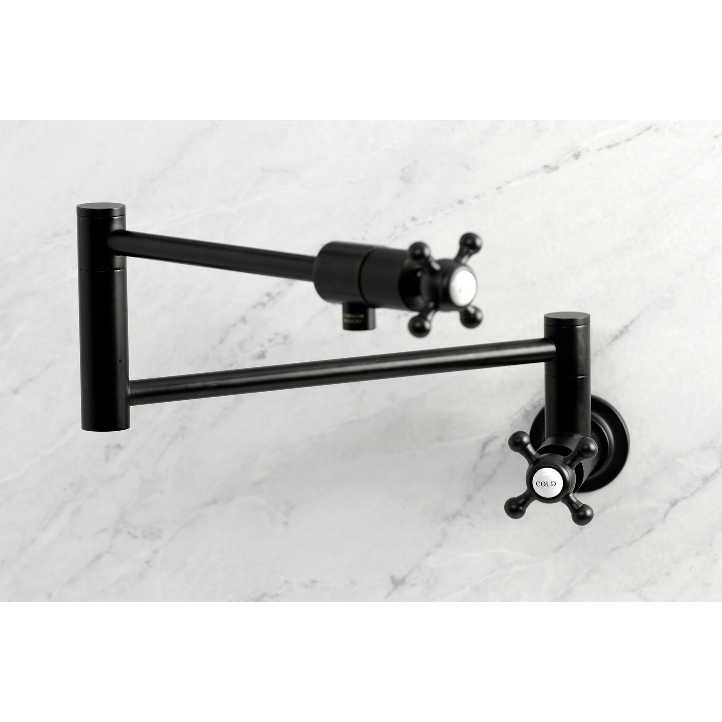 Kingston Brass KS4103BX Metropolitan Wall Mount Pot Filler Faucet, Antique Brass on marble background