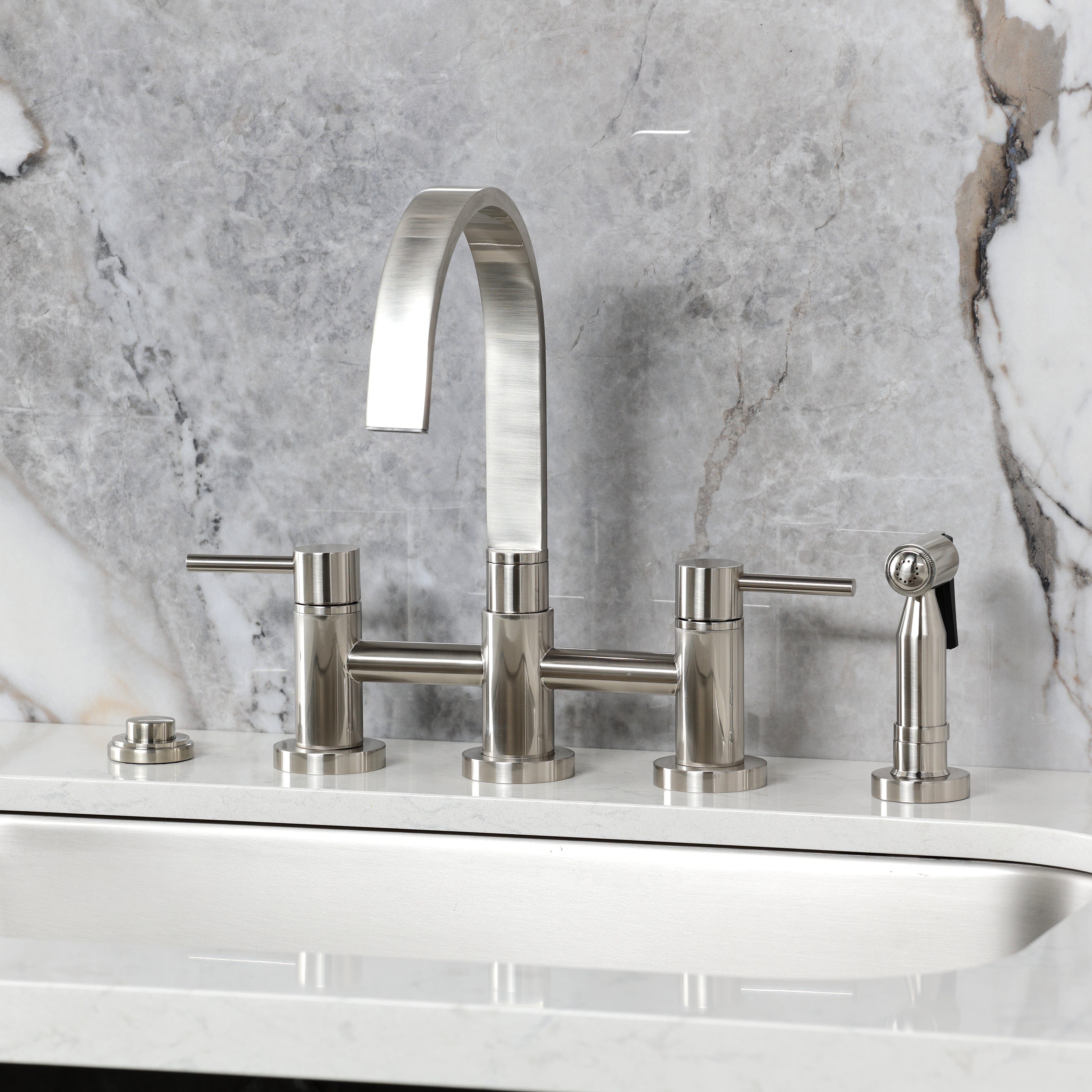 Kingston KS8267DLBS Concord Bridge Kitchen Faucet with Brass Sprayer, Brushed Brass on a modern kitchen countertop.