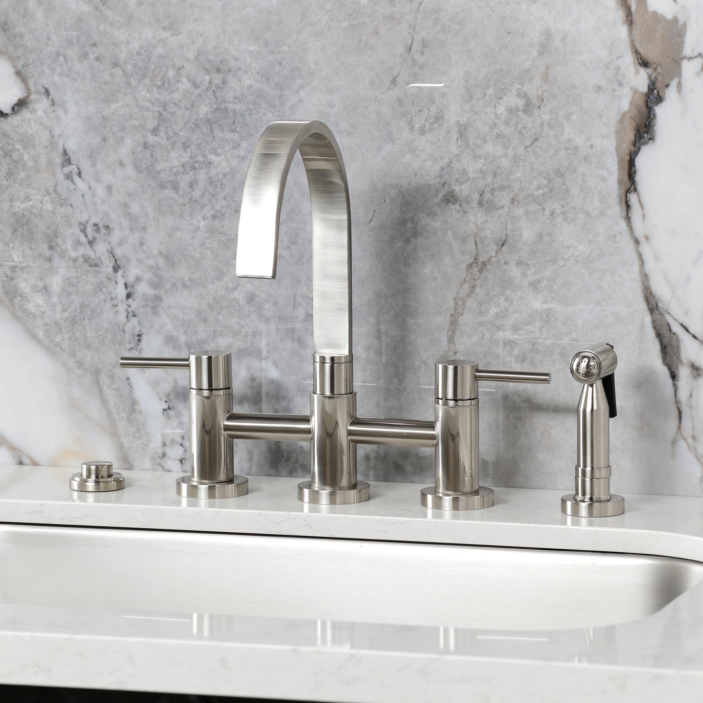 Kingston KS8267DLBS Concord Bridge Kitchen Faucet with Brass Sprayer, Brushed Brass on a modern kitchen countertop.