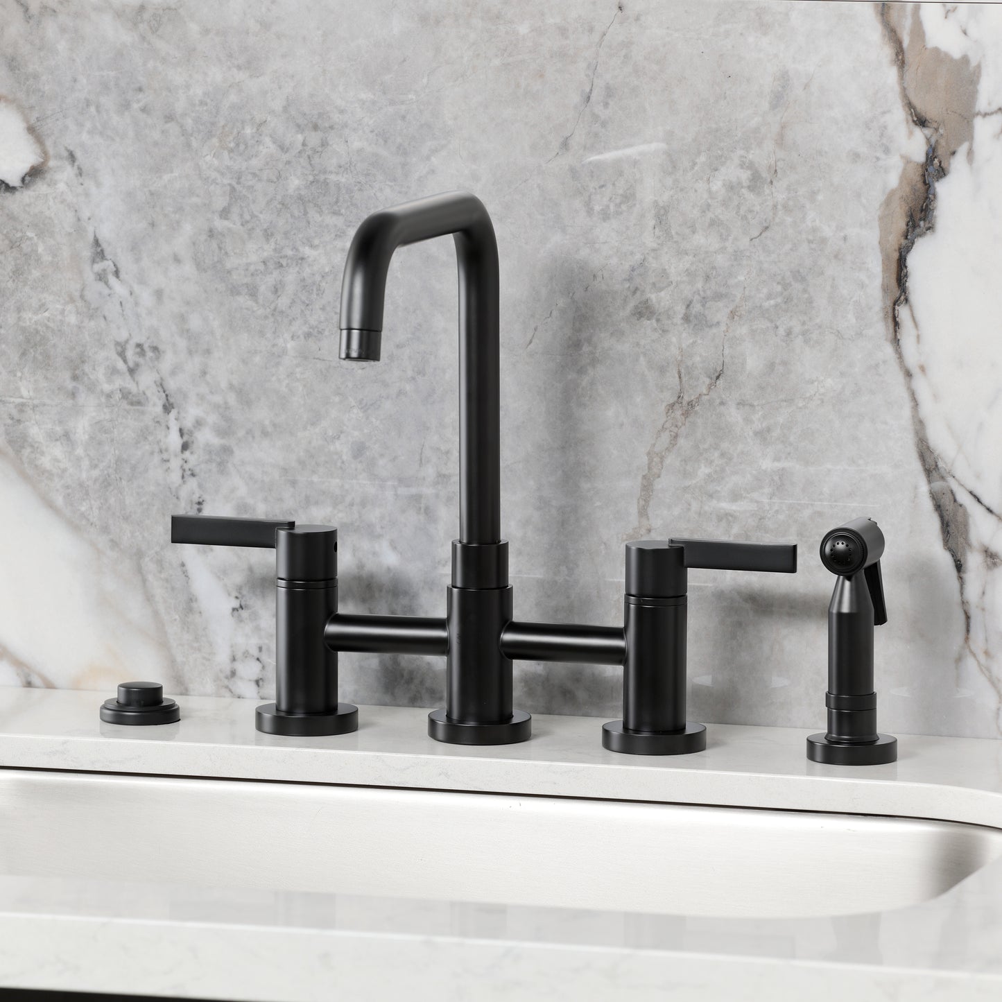 Kingston KS8287CTLBS Continental Bridge Kitchen Faucet with Brass Sprayer, Brushed Brass on a marble countertop.