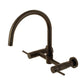 Kingston Brass KS8178DL Concord Wall Mount Bridge Kitchen Faucet in a modern bronze finish with a gooseneck design.