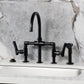 Kingston KS2333TKL Hallerbos Bridge Kitchen Faucet with Brass Sprayer, Antique Brass on marble countertop.