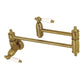 Kingston Brass KS3103PL Restoration Wall Mount Pot Filler Faucet, Antique Brass with brushed brass finish.