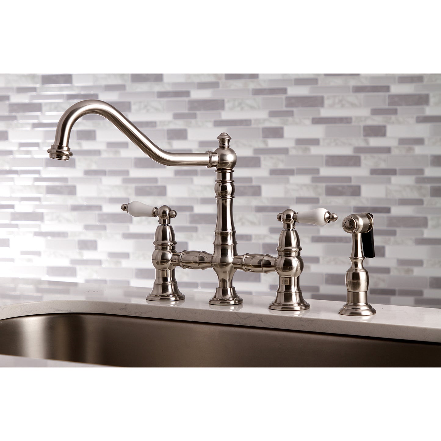 Kingston KS3277PLBS Restoration Bridge Kitchen Faucet with Brass Sprayer, Brushed Brass on kitchen sink