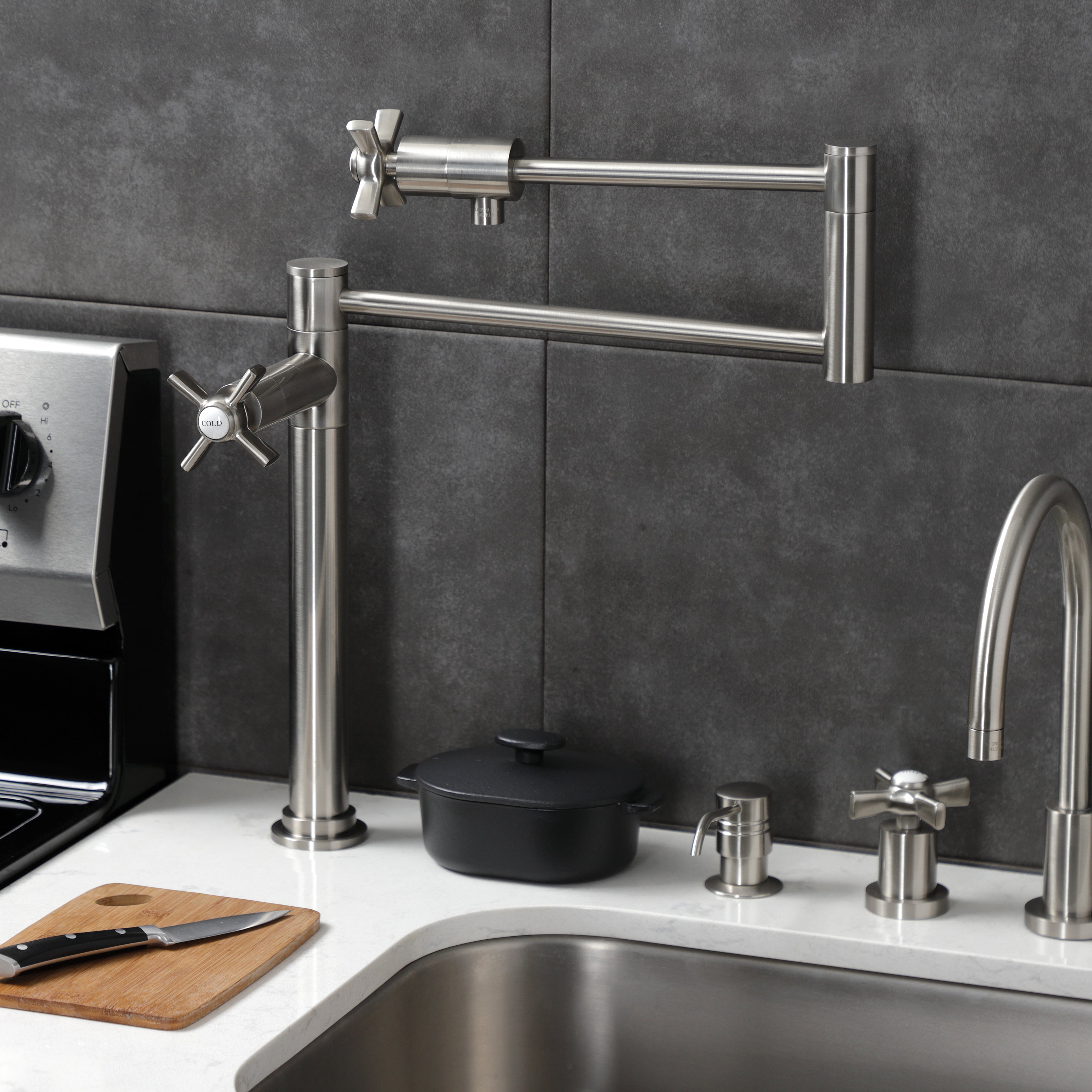 Kingston Brass KS4708ZX Millennium Deck Mount Pot Filler Faucet, Brushed Nickel close-up in modern kitchen setting.