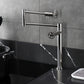 Kingston Brass KS4703CG Fuller Deck Mount Pot Filler Faucet, Antique Brass installed in a modern kitchen.