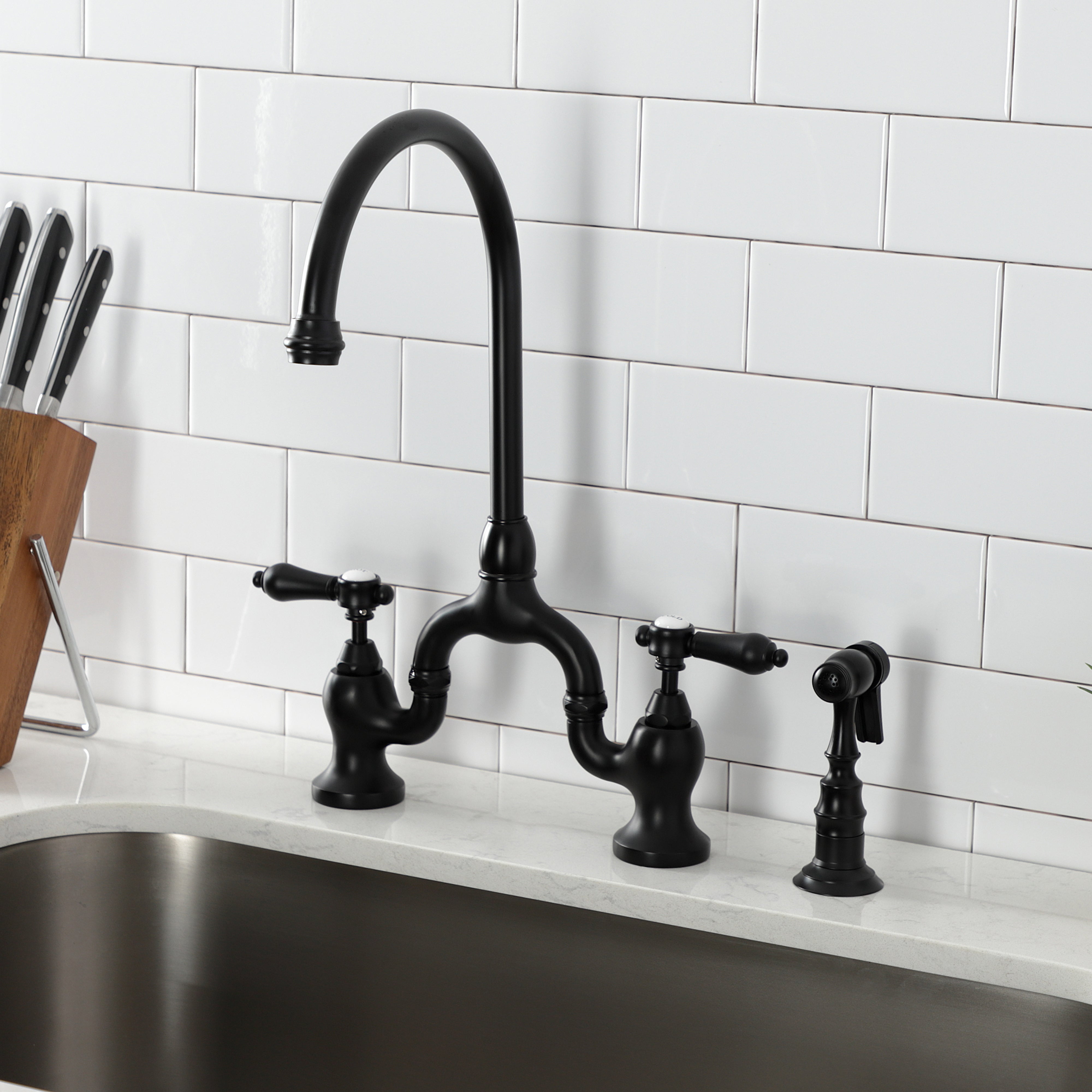 Kingston KS7793BALBS Heirloom Bridge Kitchen Faucet with Brass Sprayer, Antique Brass in black finish.