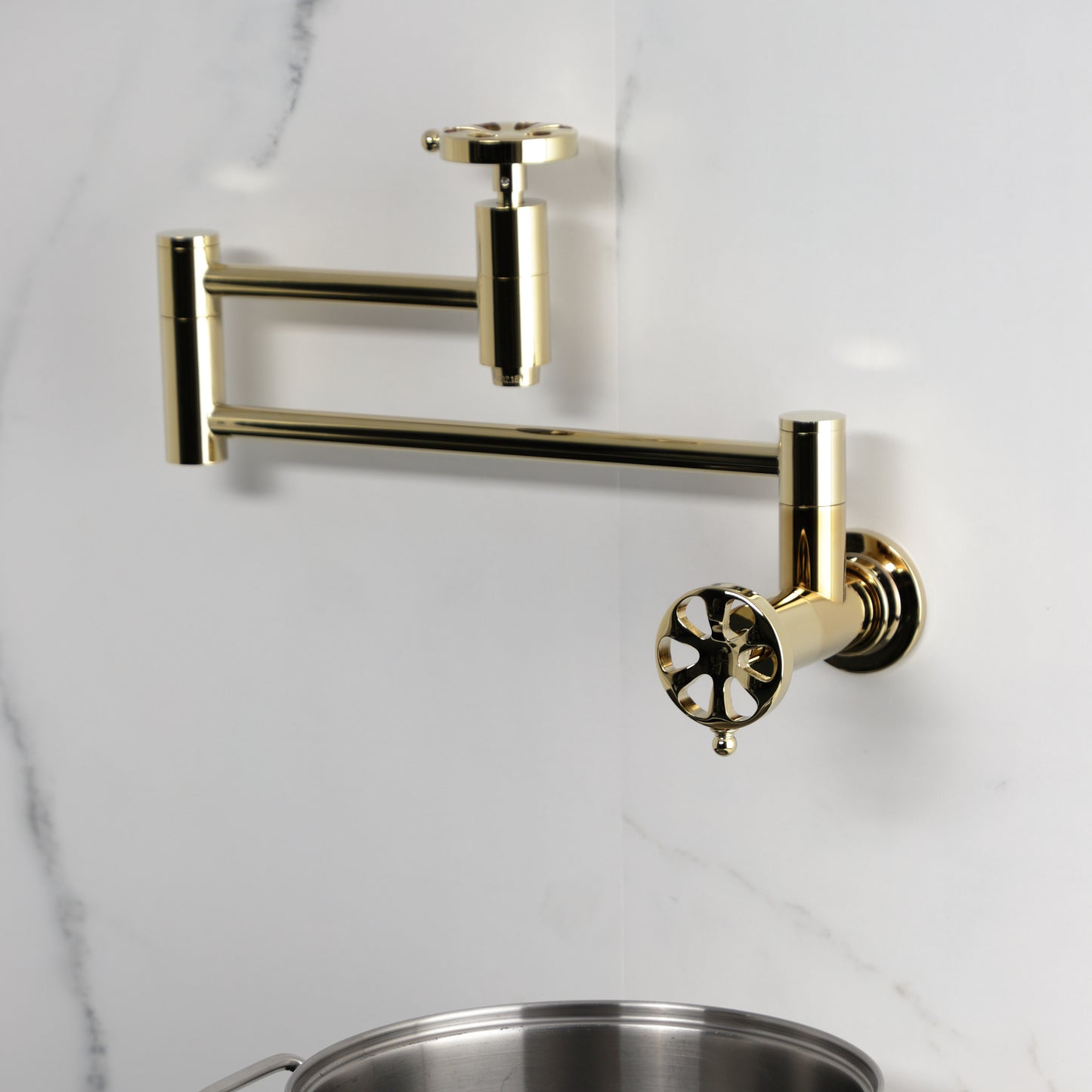 Kingston Brass KS8103RX Belknap Wall Mount Pot Filler Faucet, Antique Brass close up view of elegant design