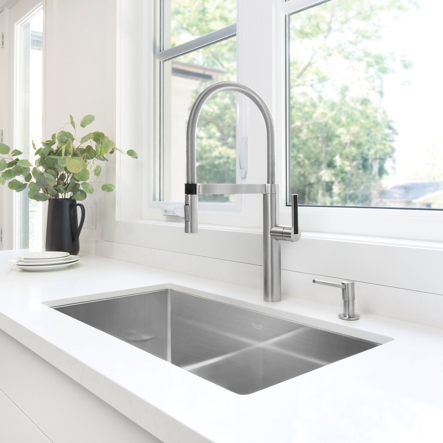 BLANCO Precision R10 32" Super Single Bowl Undermount Stainless Steel Kitchen Sink with sleek faucet and modern countertop.