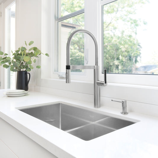 BLANCO Precision R10 32" Super Single Bowl Undermount Stainless Steel Kitchen Sink with sleek faucet and modern countertop.