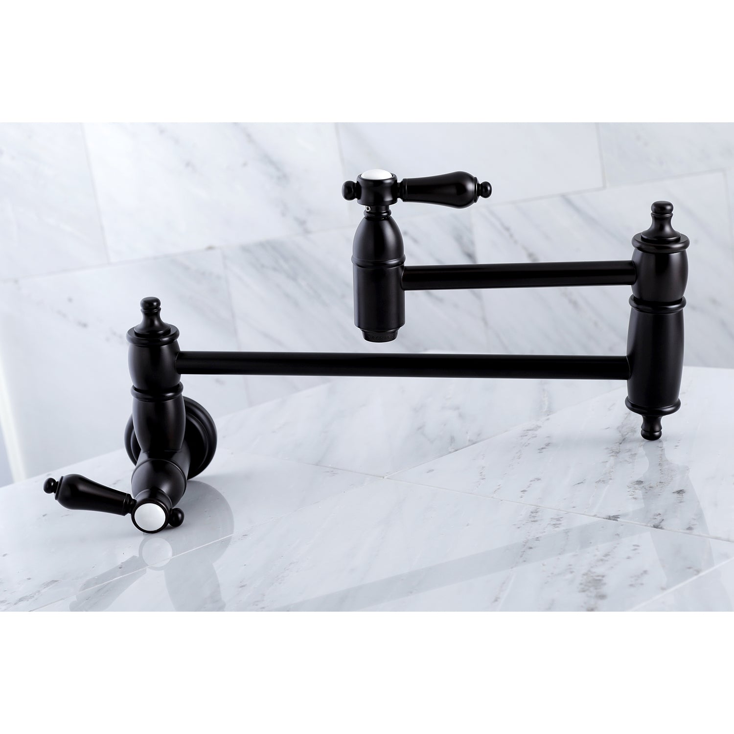 Kingston Brass KS3103BAL Heirloom Wall Mount Pot Filler Faucet, Antique Brass on marble surface