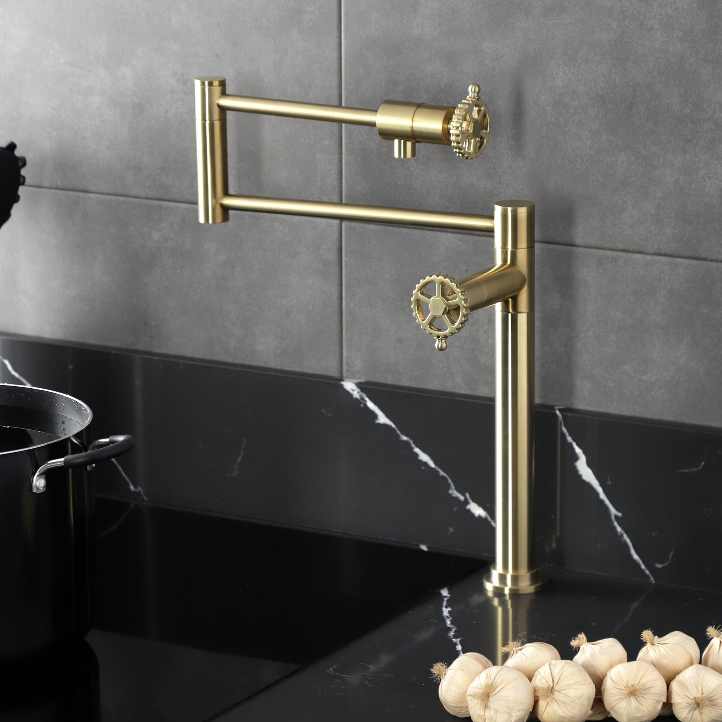 Kingston Brass KS4703CG Fuller Deck Mount Pot Filler Faucet, Antique Brass with foldable swing arms on kitchen counter.