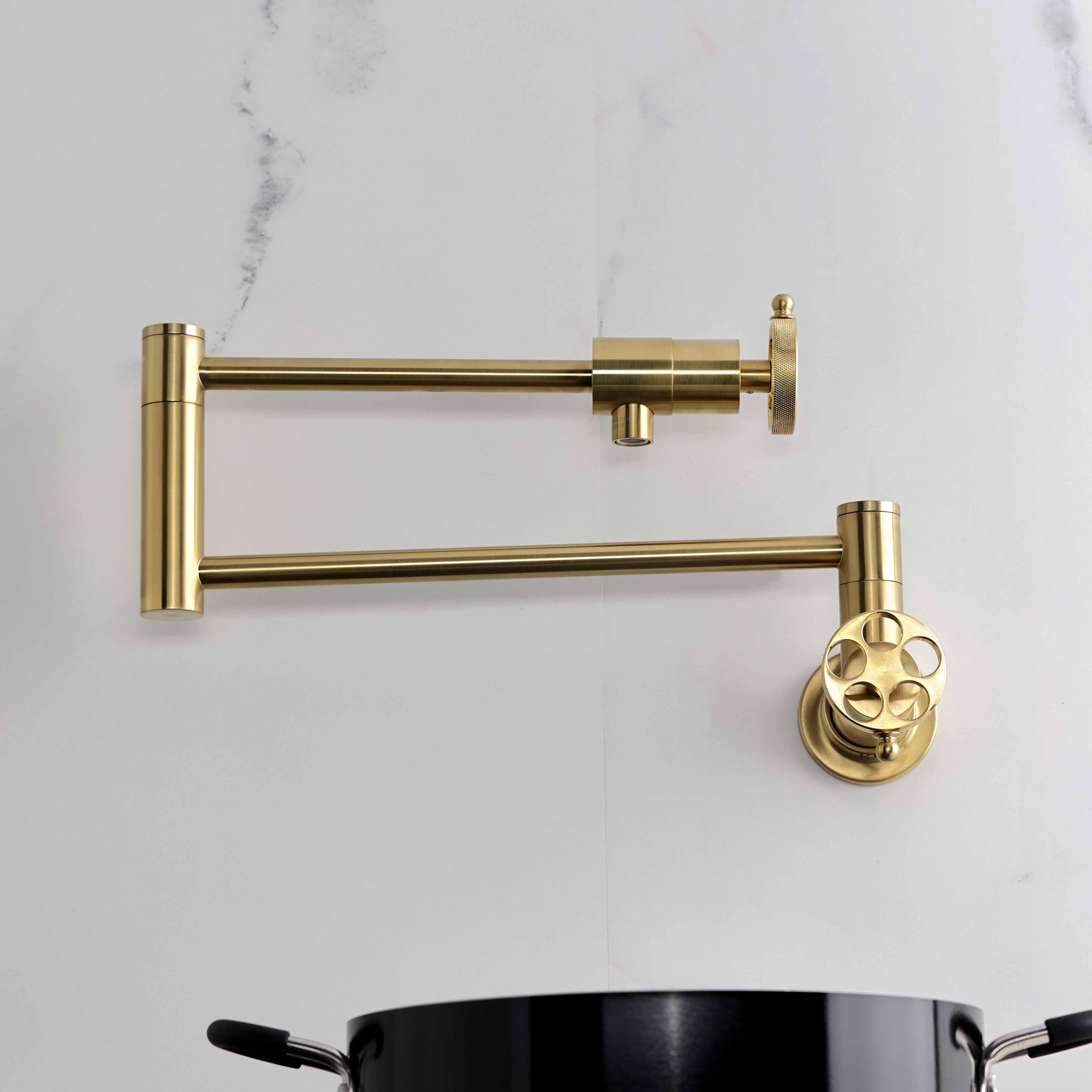 Kingston Brass KS4103RKZ Wendell Wall Mount Pot Filler Faucet with Knurled Handle, Antique Brass image showing the faucet design.