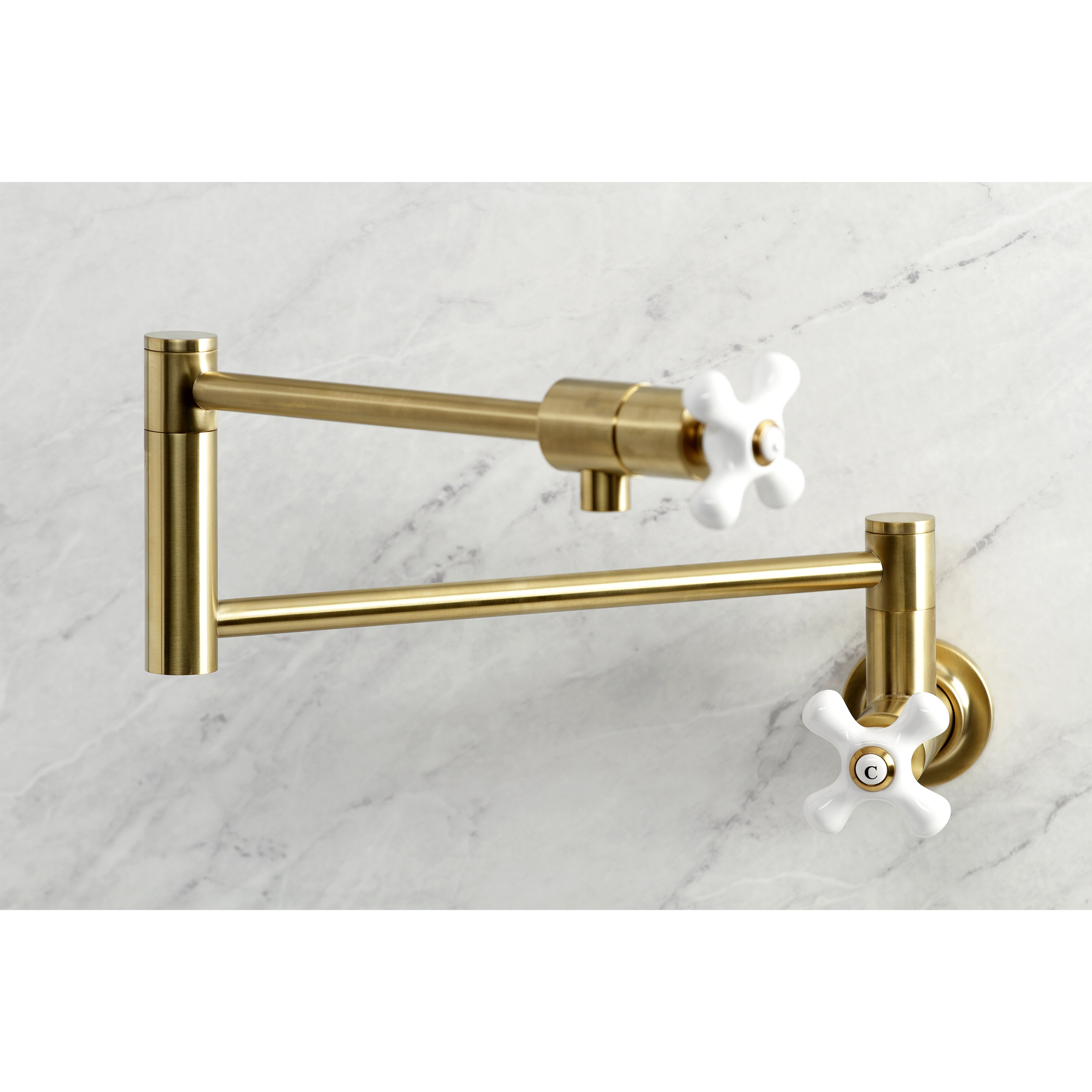 Kingston Brass KS4107PX Metropolitan Wall Mount Pot Filler Faucet, Brushed Brass close-up image with swing arms