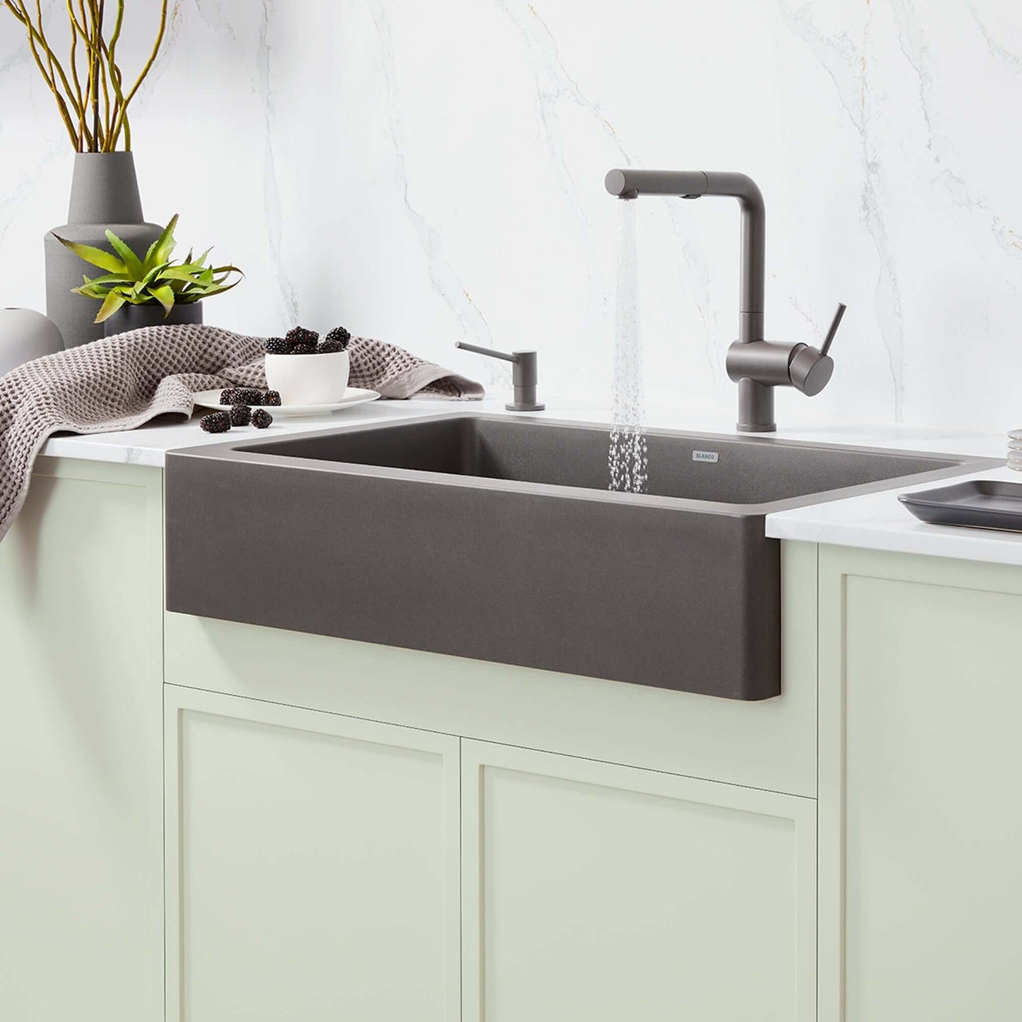 BLANCO Linus Low Arc Pull-Out Dual-Spray Kitchen Faucet - Volcano Gray in modern kitchen with sleek design and elegant sink.