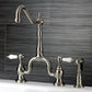 Kingston KS7753BPLBS Bel-Air Bridge Kitchen Faucet with Brass Sprayer, Antique Brass in a sleek design with porcelain levers.