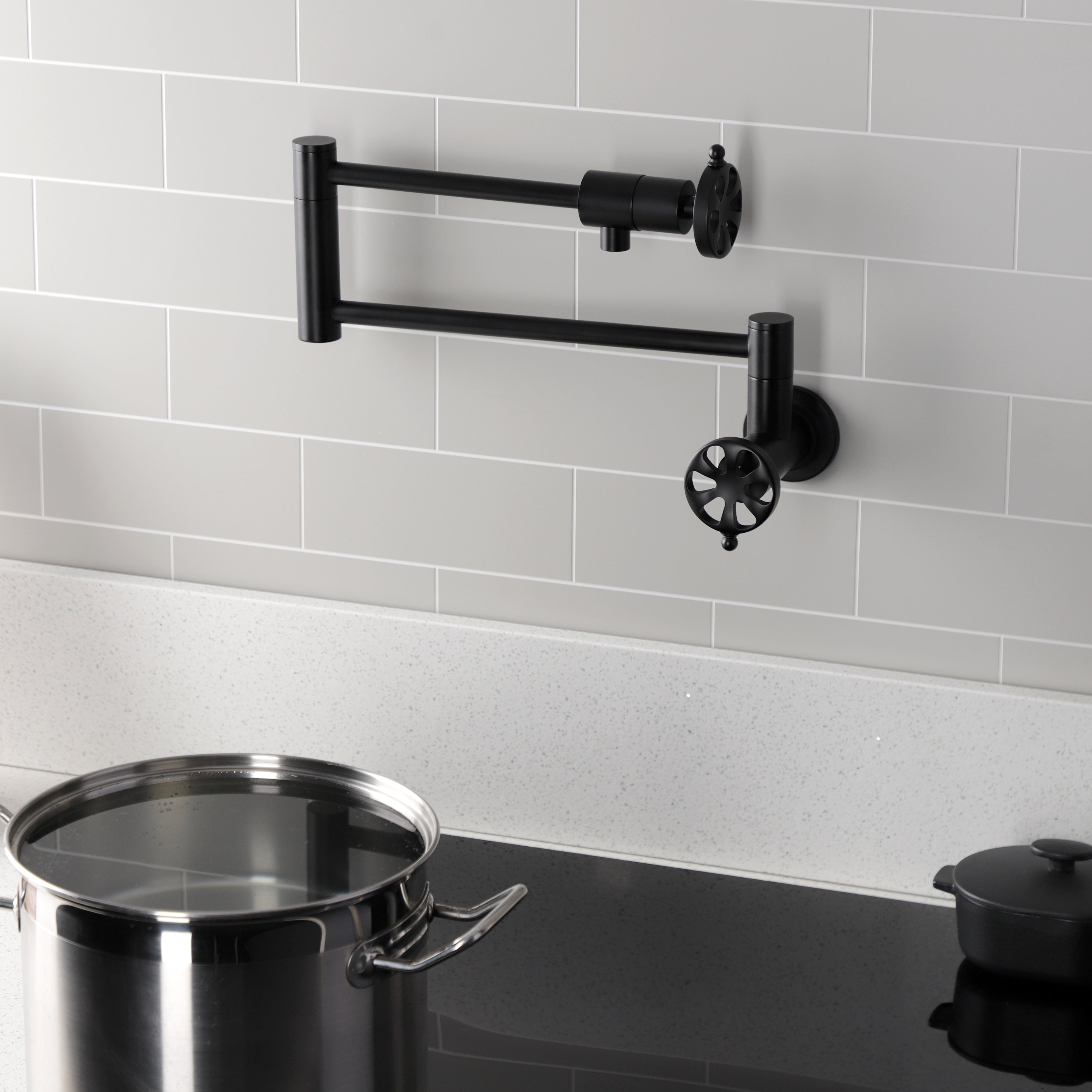 Kingston Brass KS4103RX Belknap Wall Mount Pot Filler Faucet, Antique Brass installed in kitchen