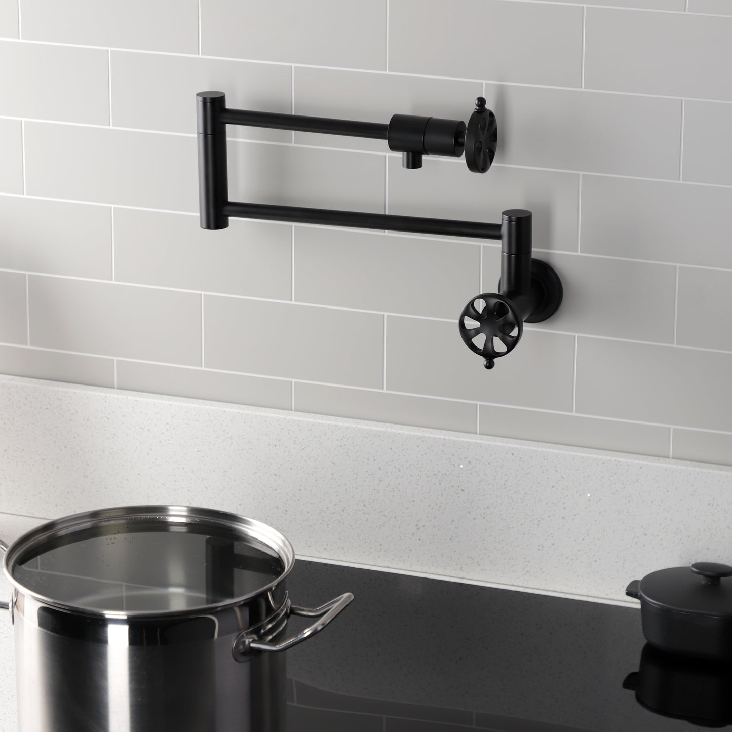 Kingston Brass KS4103RX Belknap Wall Mount Pot Filler Faucet, Antique Brass installed in kitchen