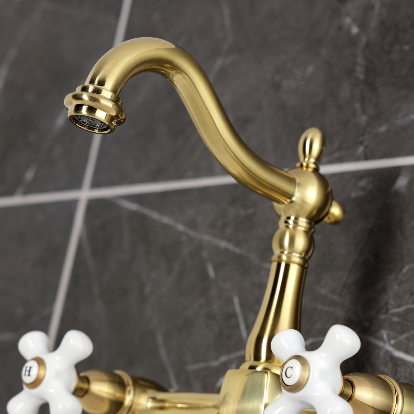 Kingston KS1263PX Heritage Two-Handle Wall Mount Bridge Kitchen Faucet, Antique Brass close-up view