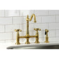 Kingston KS1273AXBS Heritage Bridge Kitchen Faucet with Brass Sprayer, Antique Brass on a kitchen sink
