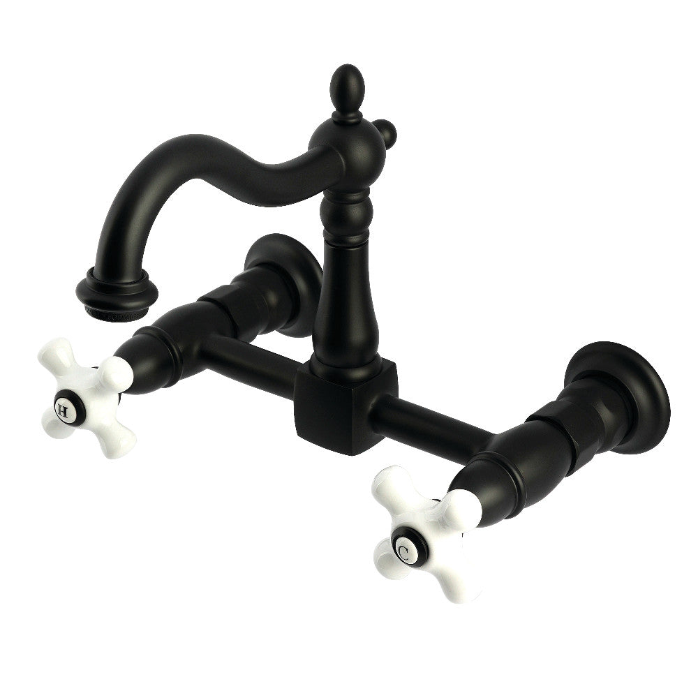 Kingston KS1263PX Heritage Two-Handle Wall Mount Bridge Kitchen Faucet, Antique Brass with black finish and white cross handles.