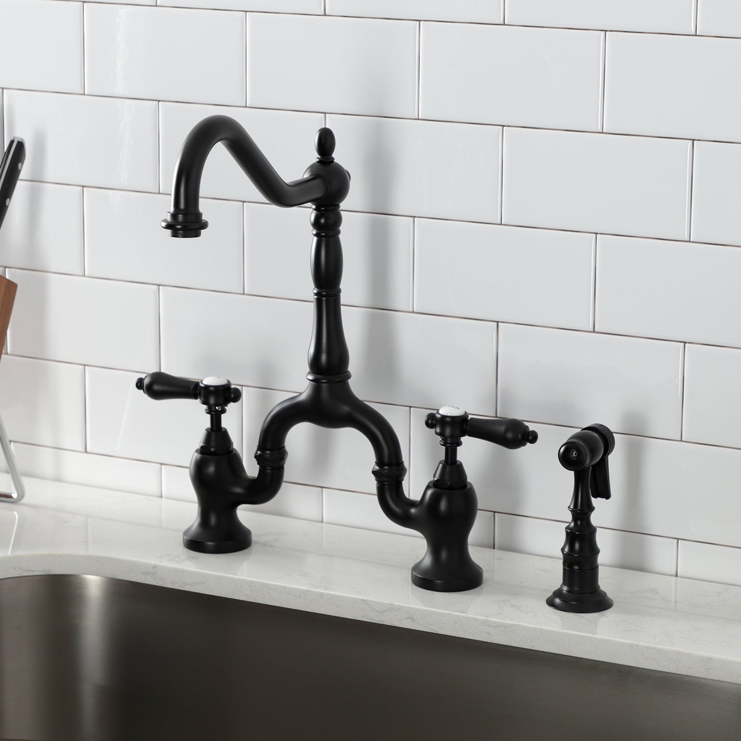 Kingston KS7753BALBS Heirloom Bridge Kitchen Faucet with Brass Sprayer, Antique Brass in stylish black finish.